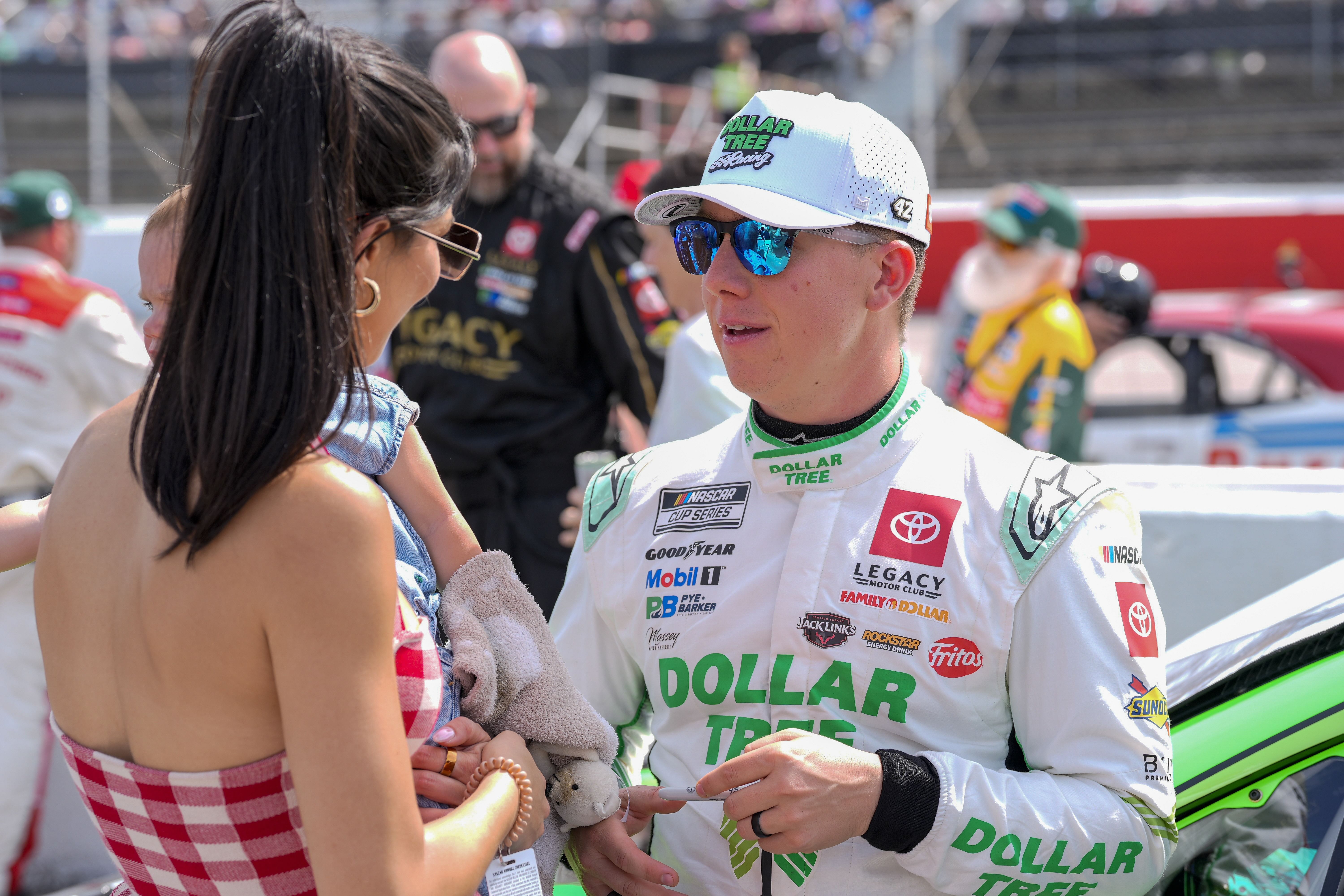 John Hunter Nemechek with his wife Taylor and daughter during the Goodyear 400 at Darlington Raceway - Source: Imagn